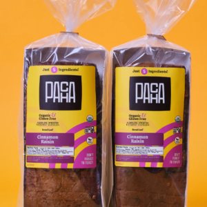 Two packages of Pacha cinnamon raisin sprouted sourdough buckwheat bread.